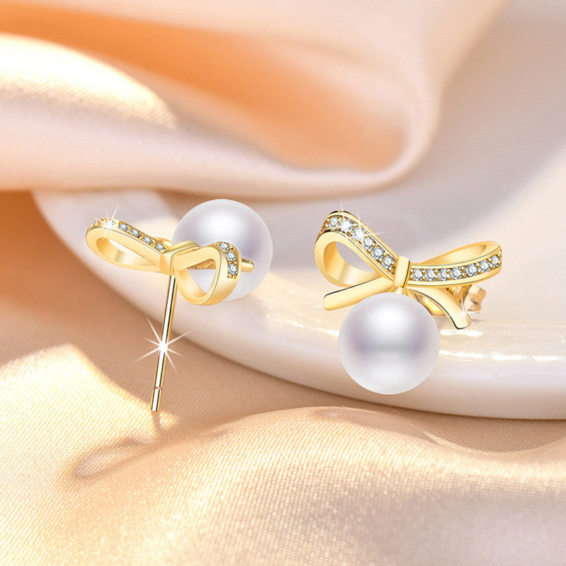 GOLD PLATED AMERICAN DIAMOND STUDDED BOW-TIE SHAPE KOREAN STUD EARRINGS