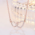 ROSE GOLD PLATED AMERICAN DIAMOND STUDDED DUAL HEART CONTEMPORARY KOREAN PENDANT